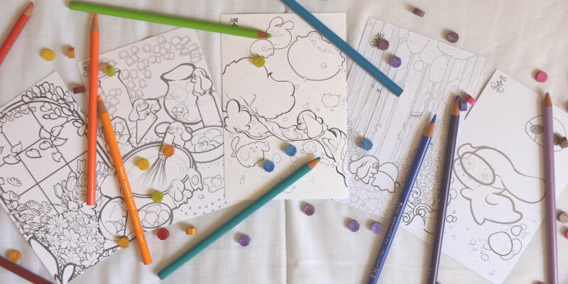 Photo of a pile of coloring cards featuring artwork made by Aryssa.